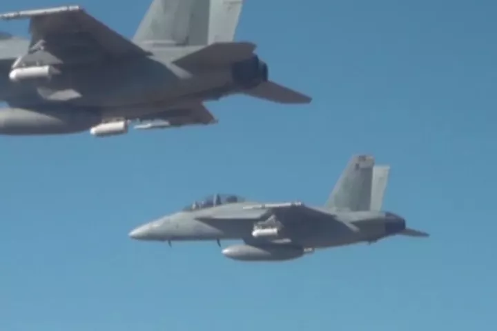 The 103 drones were dropped from flare dispensers mounted on three F/A-18 Super Hornets