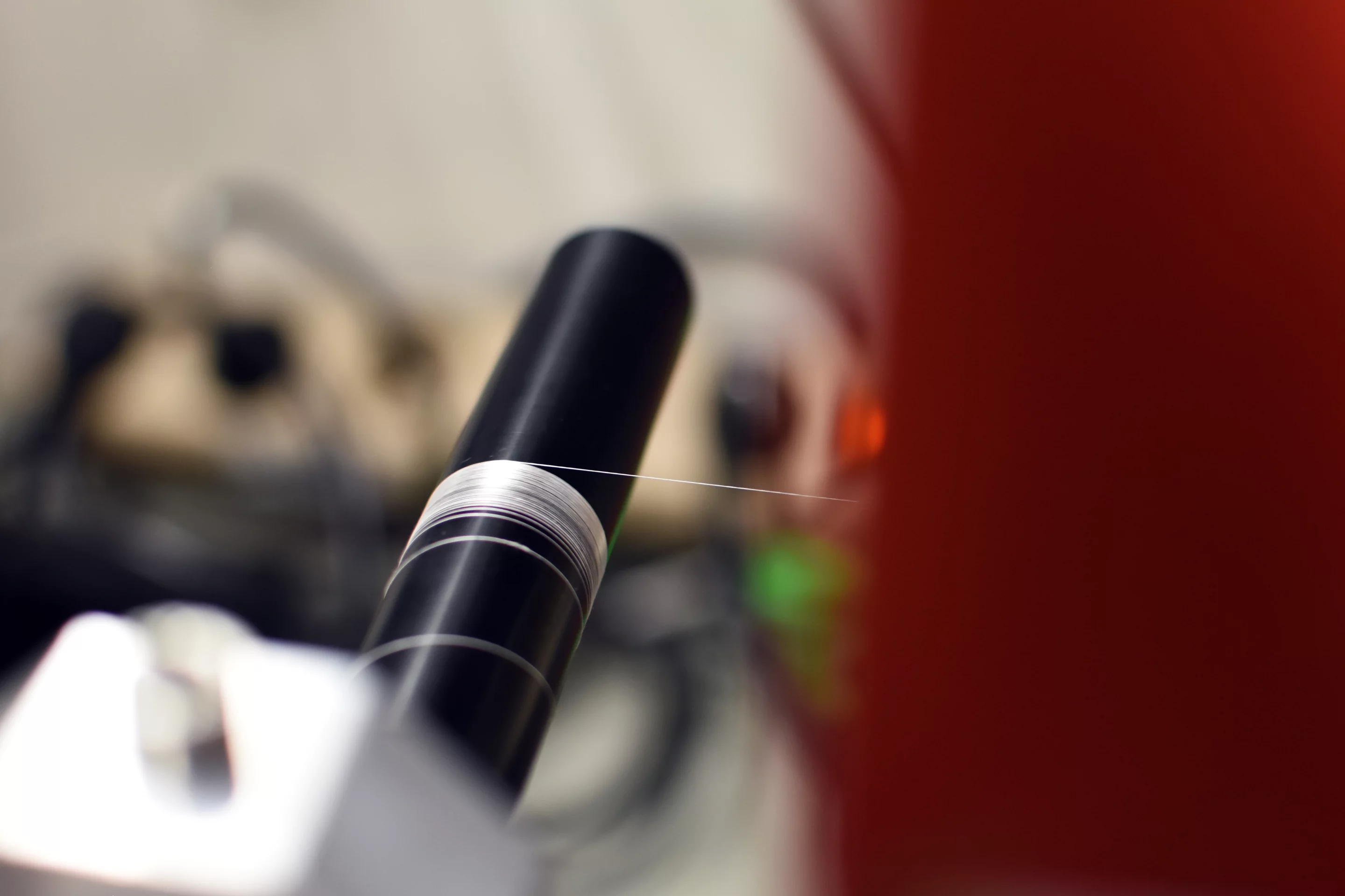 The fibers are heated and then cooled, while being stretched