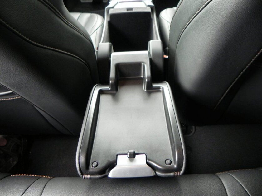 In the V60, the lid for the center console storage box flips all the way back to become a convenient tray for rear passengers