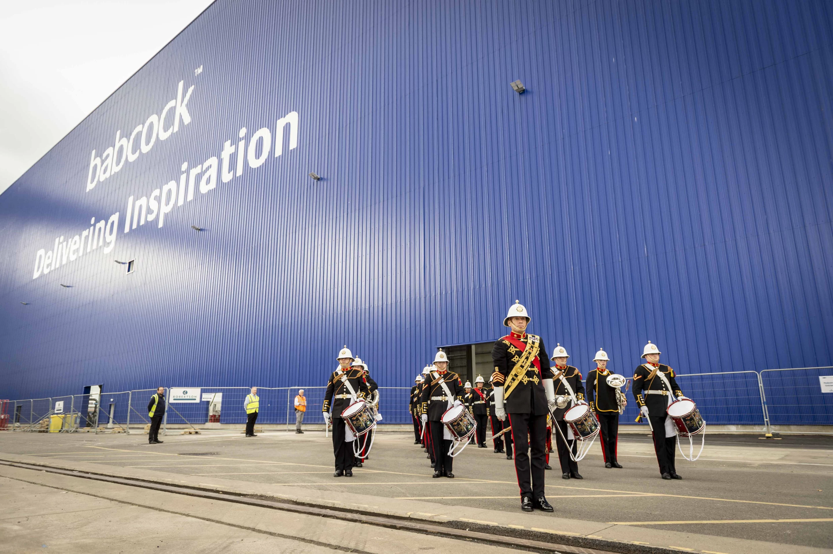 The Royal Marines Band performing during a ceremony held at Rosyth dockyard to mark the steel cutting of the first Type 31 ship, HMS Venturer