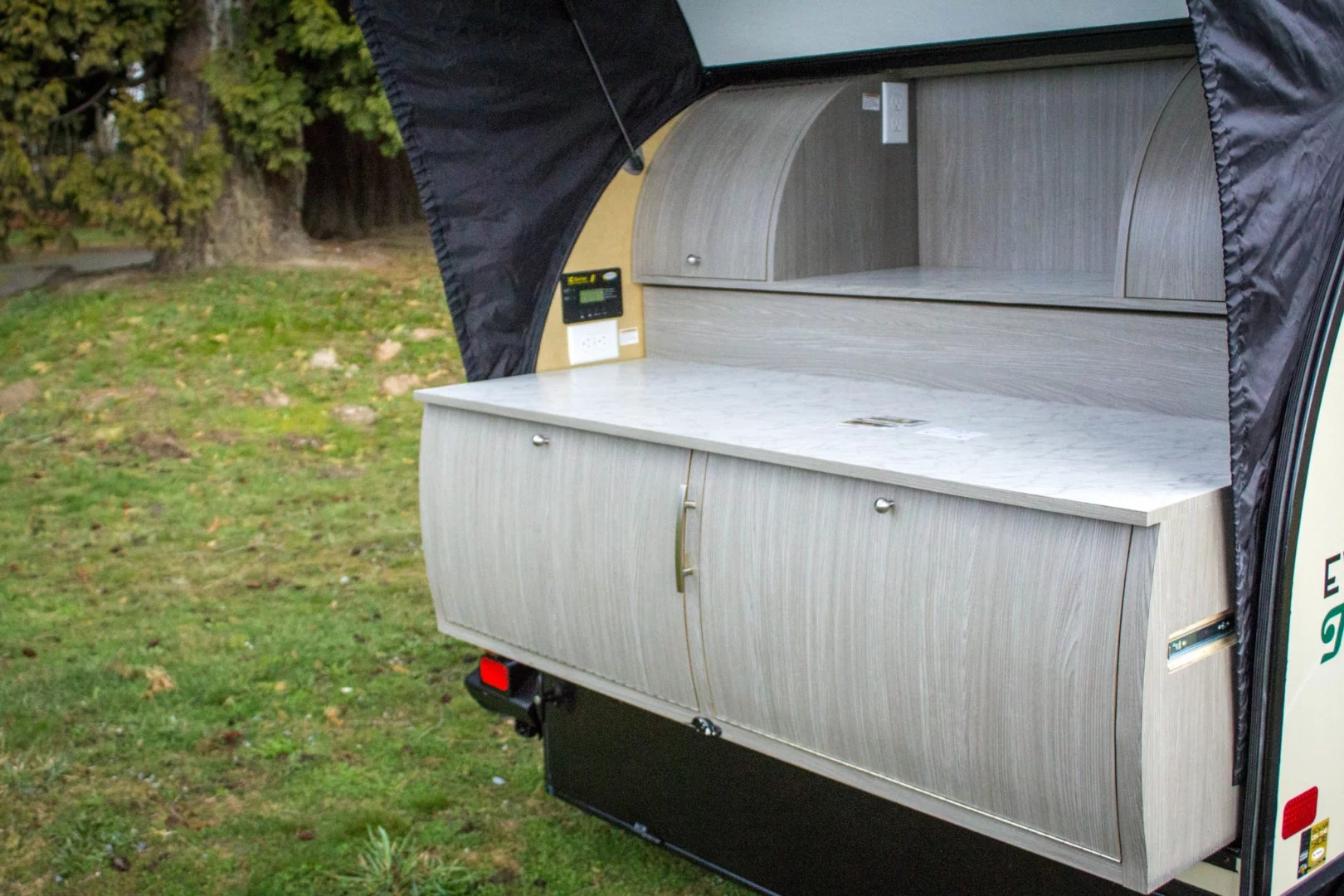 The Traverse model comes standard with a full-width slide-out kitchen, a different spin on the usual small trailer slide-out kitchen