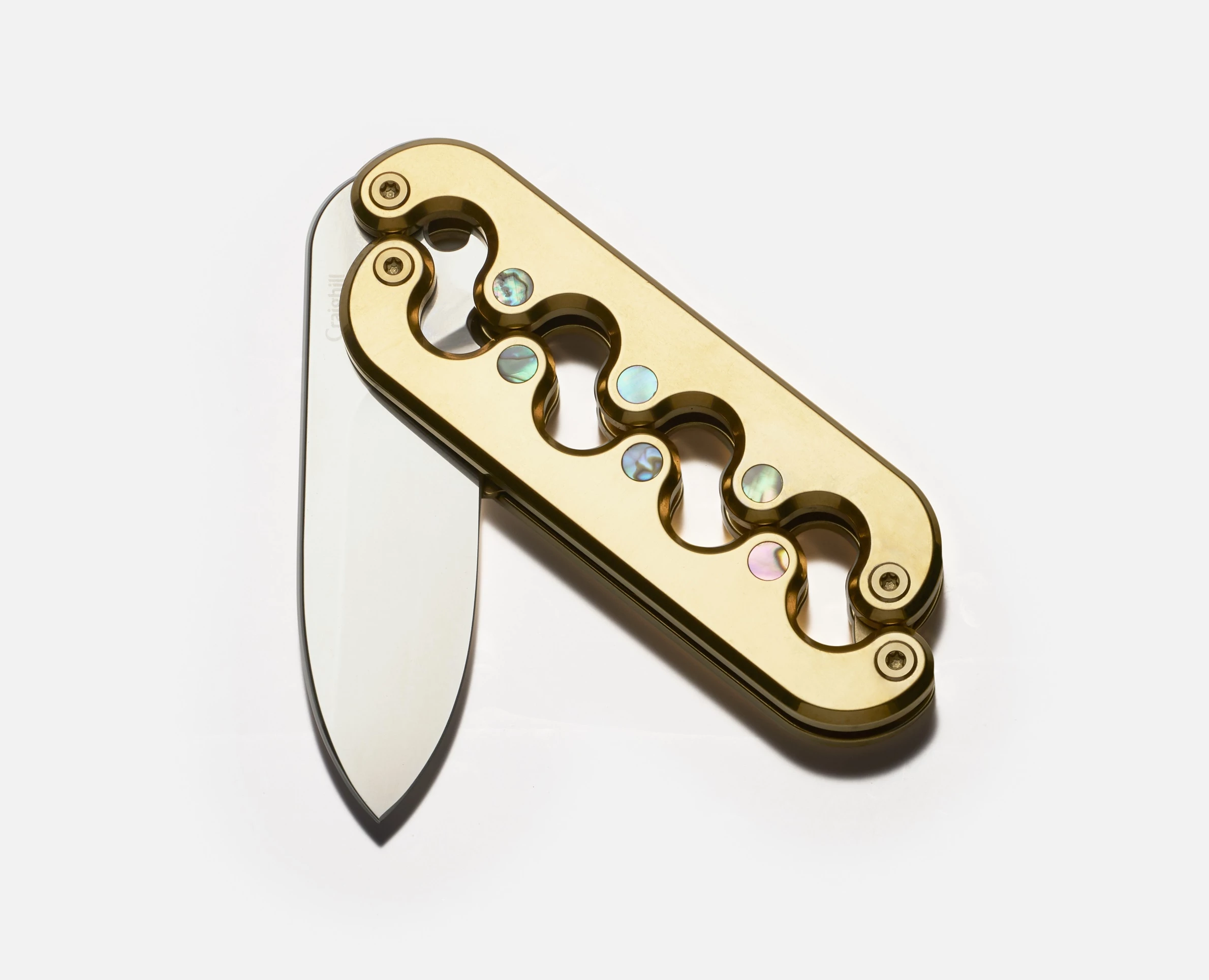 The Sidewinder Deluxe comes in polished silver or "vapor gold" with contrasting "abalone" inserts that shift color in the light