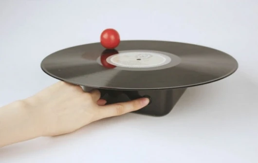 Carefully place the sphere on top of the LP and press the button - then pray