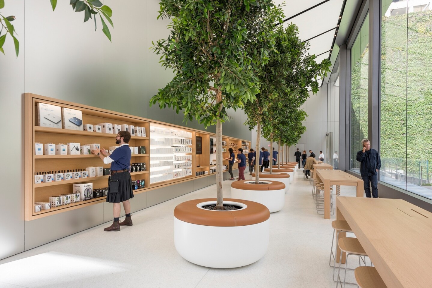 "The Avenue" is a new take on displaying products inspired by seasonal store-front displays and is attended by Apple staff to provide visitors with information