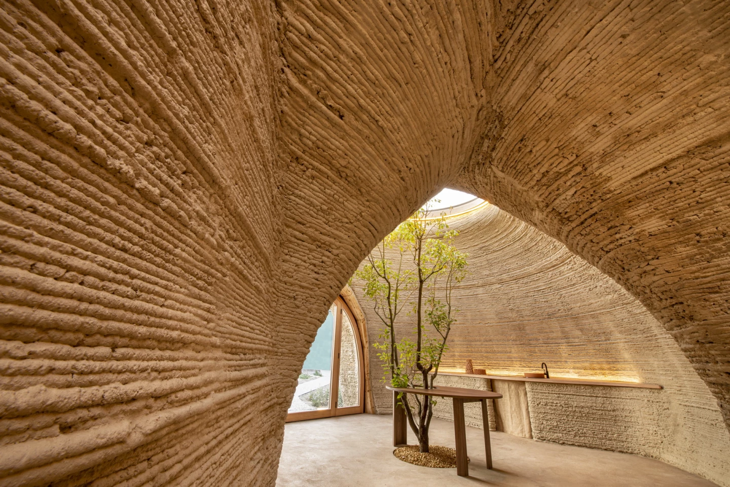 The first TECLA home measures approximately 60 sq m (646 sq ft) and features an open living zone with kitchen