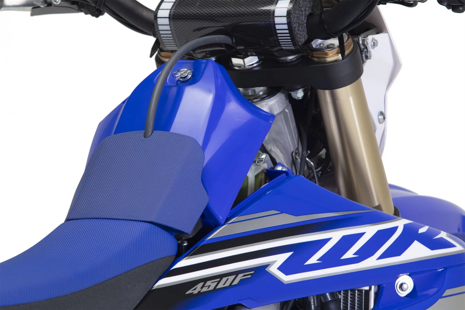 Right in front of the seat is a cover that reveals the fuel cap and air filter element of the 2019 Yamaha WR450F