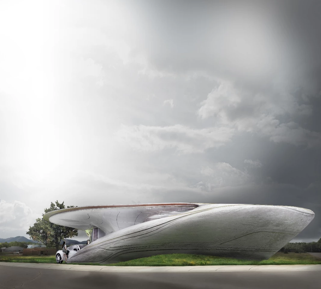 The curved form is designed to blend with the site like an organic presence