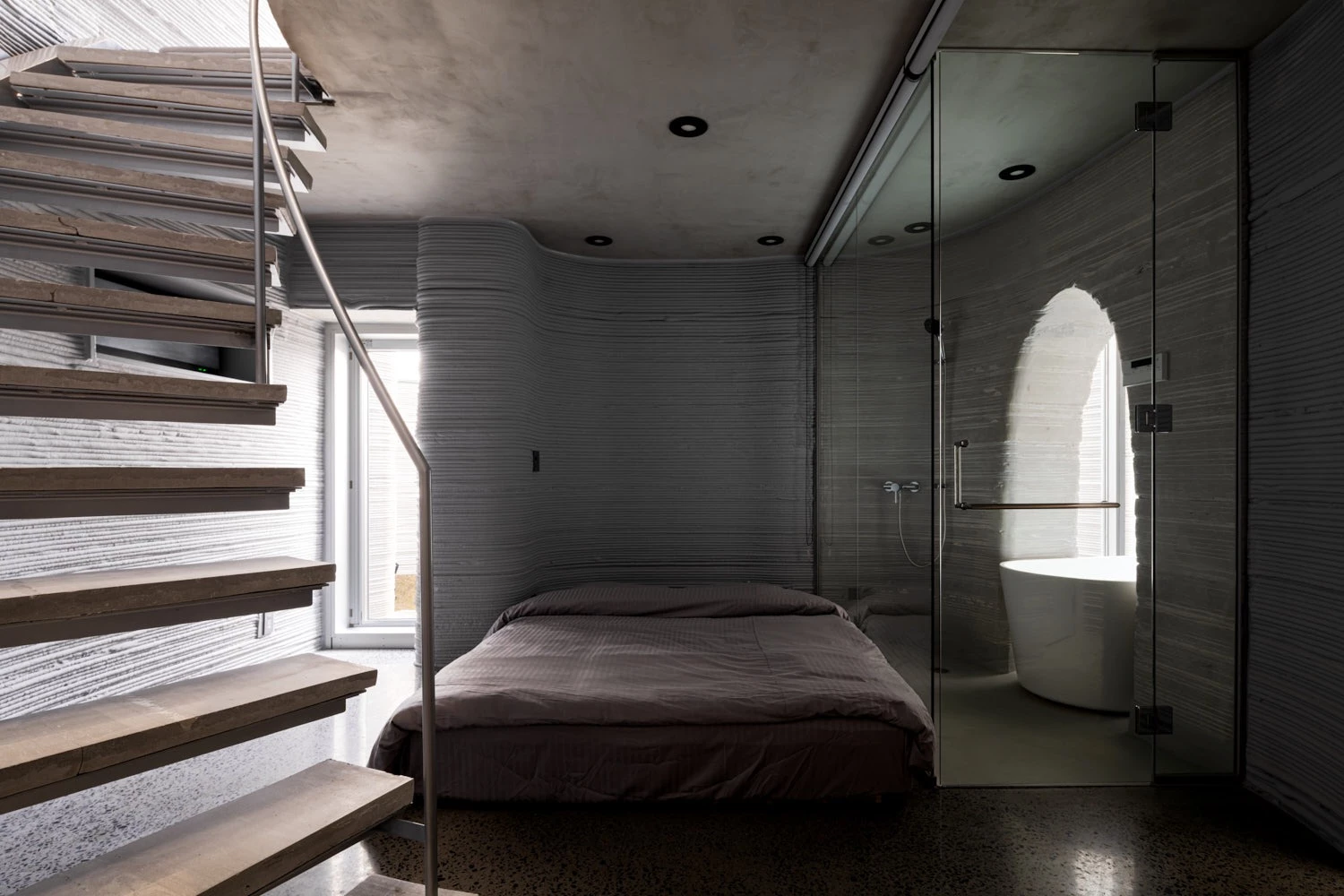 The O House's downstairs bedroom includes an en-suite bathroom 
