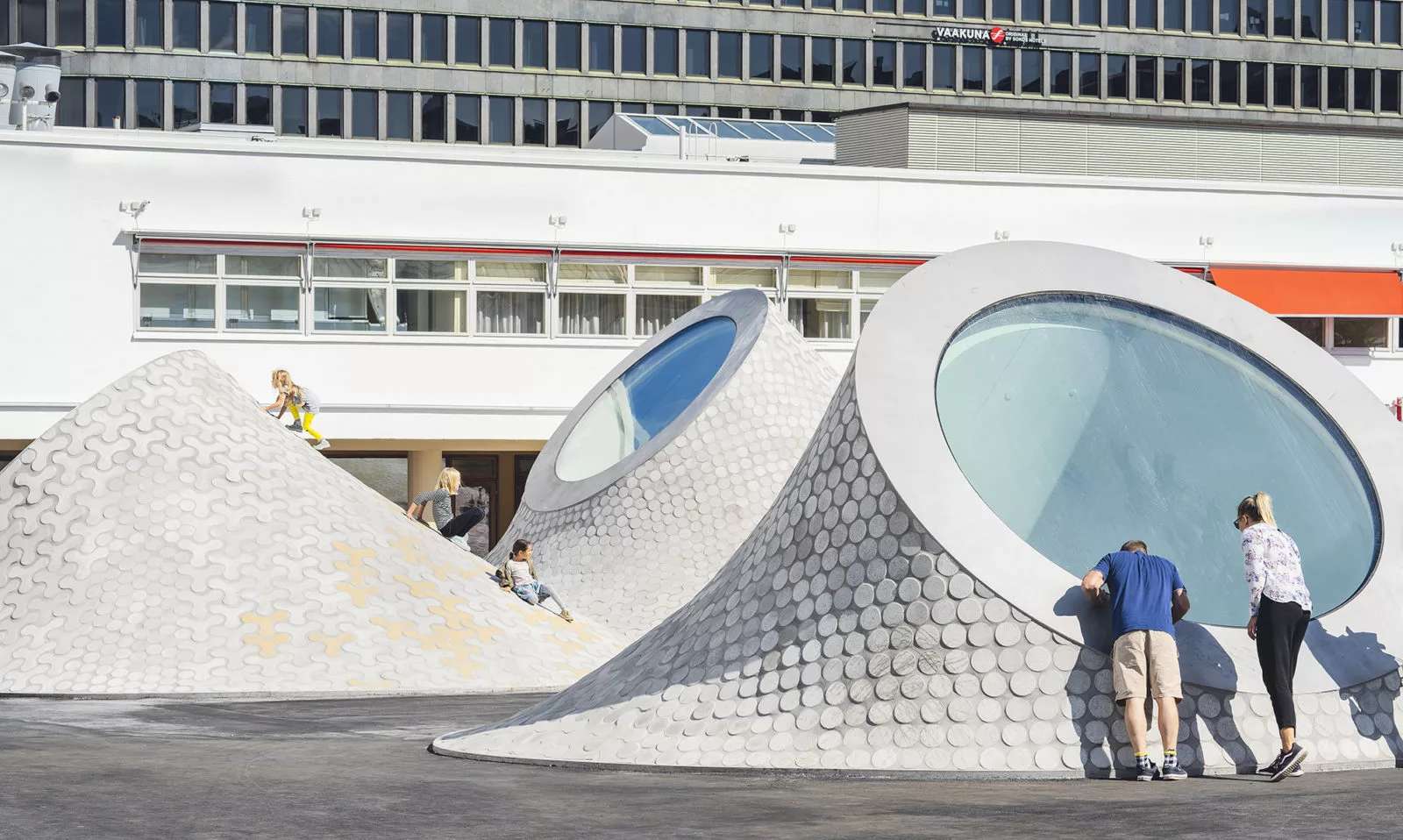 Visitors take in the renovated Lasipalatsi Square in Helsinki