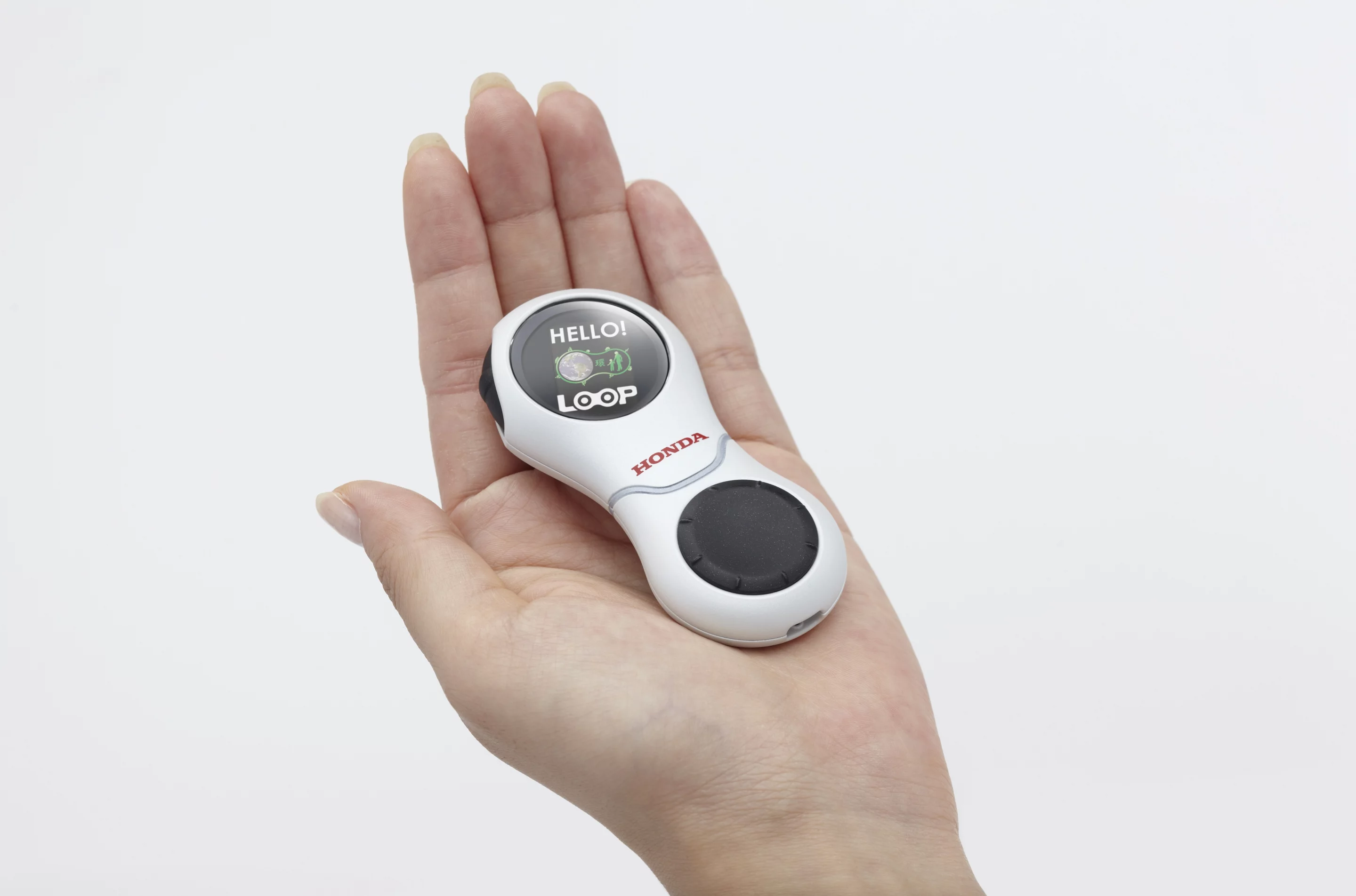 The U3-X shape was used in a much smaller form factor named the LOOP which Honda showed at the Tokyo Motor Show in 2009. The LOOP was a portable communication tool that allowed people and mobility devices to communicate with each other. (Image: Honda)