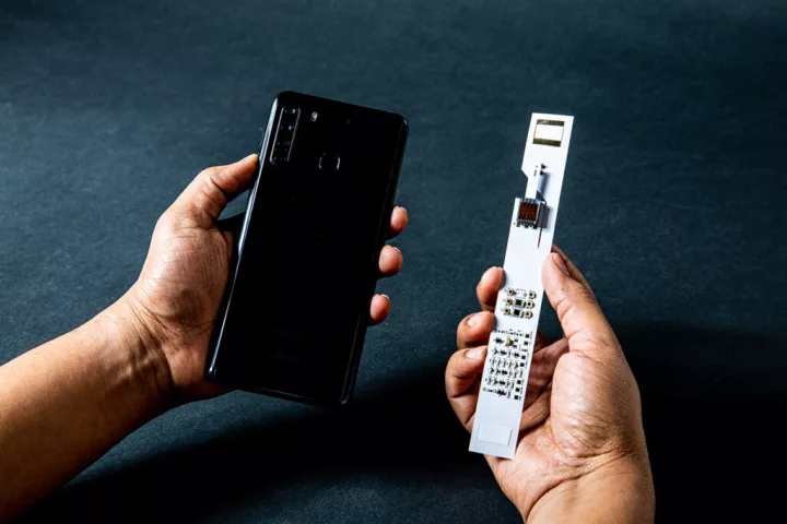 A prototype system developed at UW uses the phone's flash to power a sensor strip