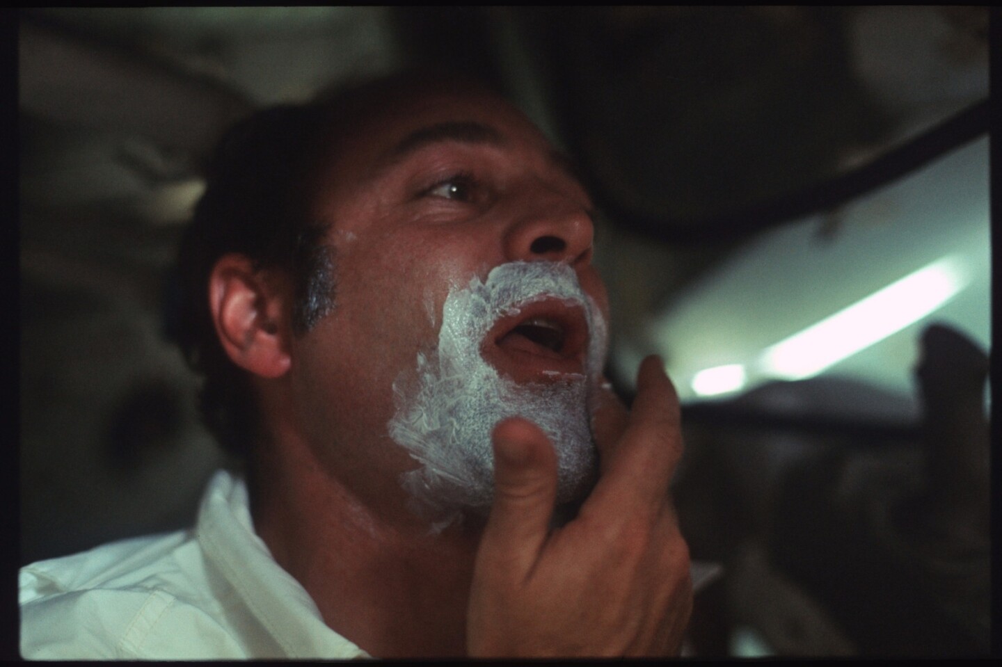 Lunar Module pilot Harrison Schmitt taking care of life's little details during the Apollo 17 mission