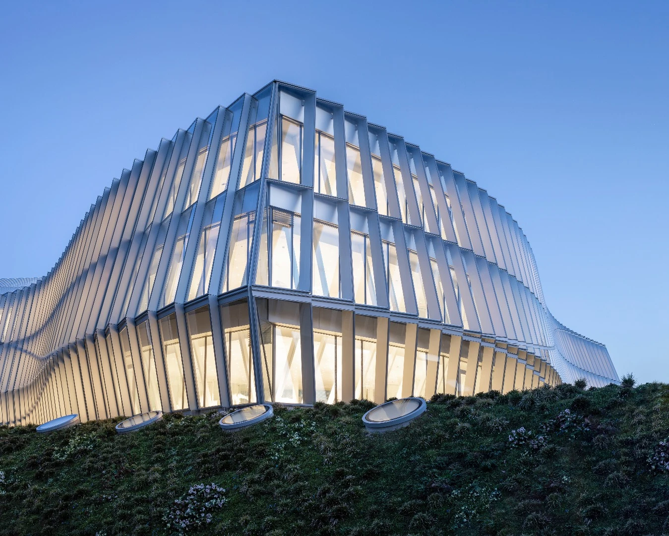 The Olympic House is defined by its glazed facade