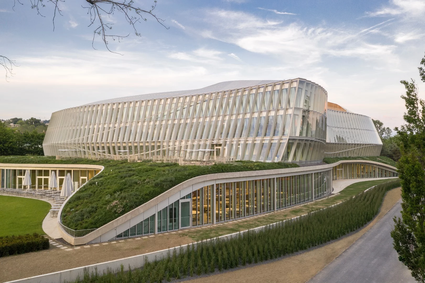 "A hallmark of 3XN’s design, the facade pays tribute to the Olympic spirit by emulating the graceful movements of an athlete," says the firm