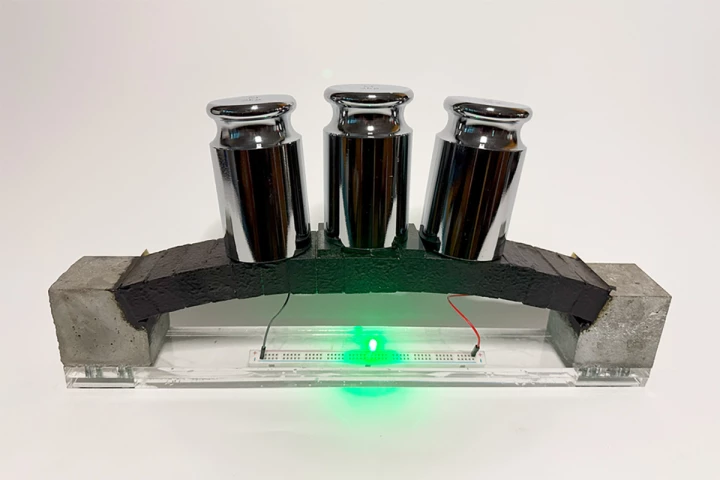 An ec3-based arch structure integrates supercapacitor electrodes, demonstrating both structural load bearing and the ability to power an LED