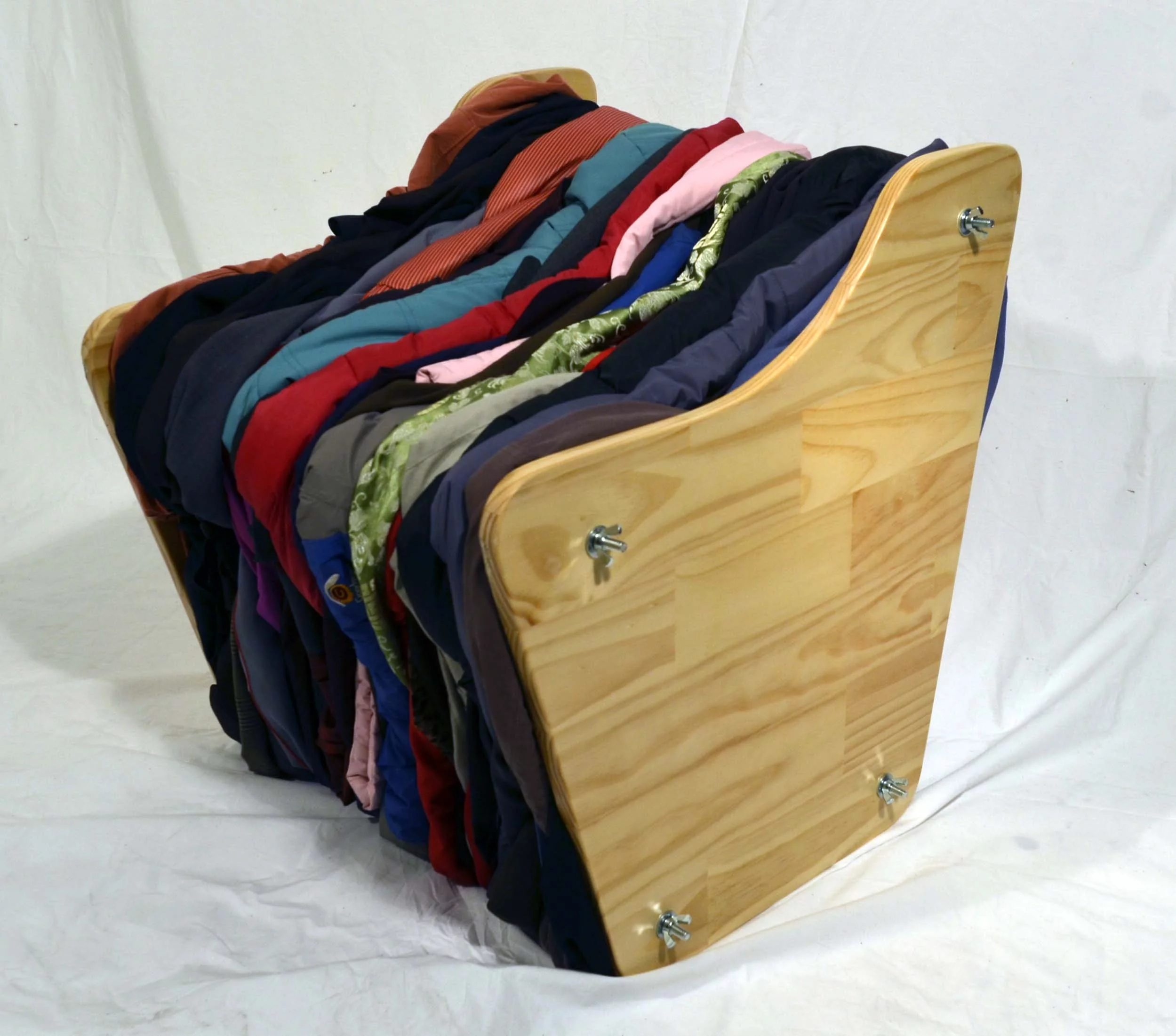 The “Press” chair uses a creative folding technique and two end plates, which compress the textiles together