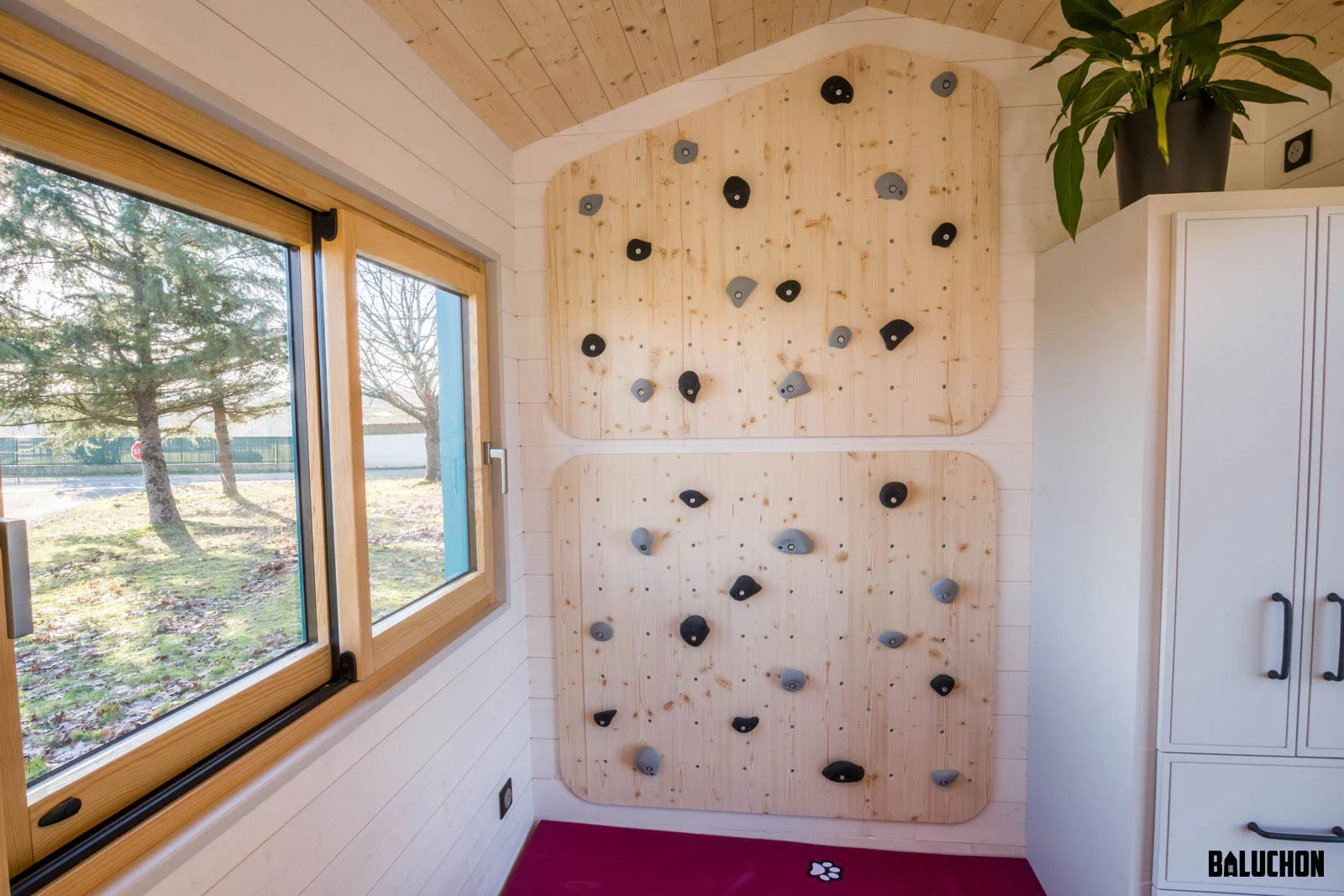 La Maison du Bonheur features a climbing wall area for kids