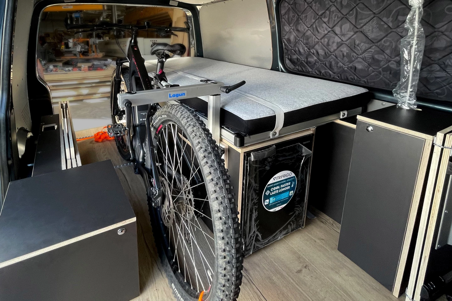 During transit, the passenger-side module can fold in to make room for cargo, such as boards and bikes
