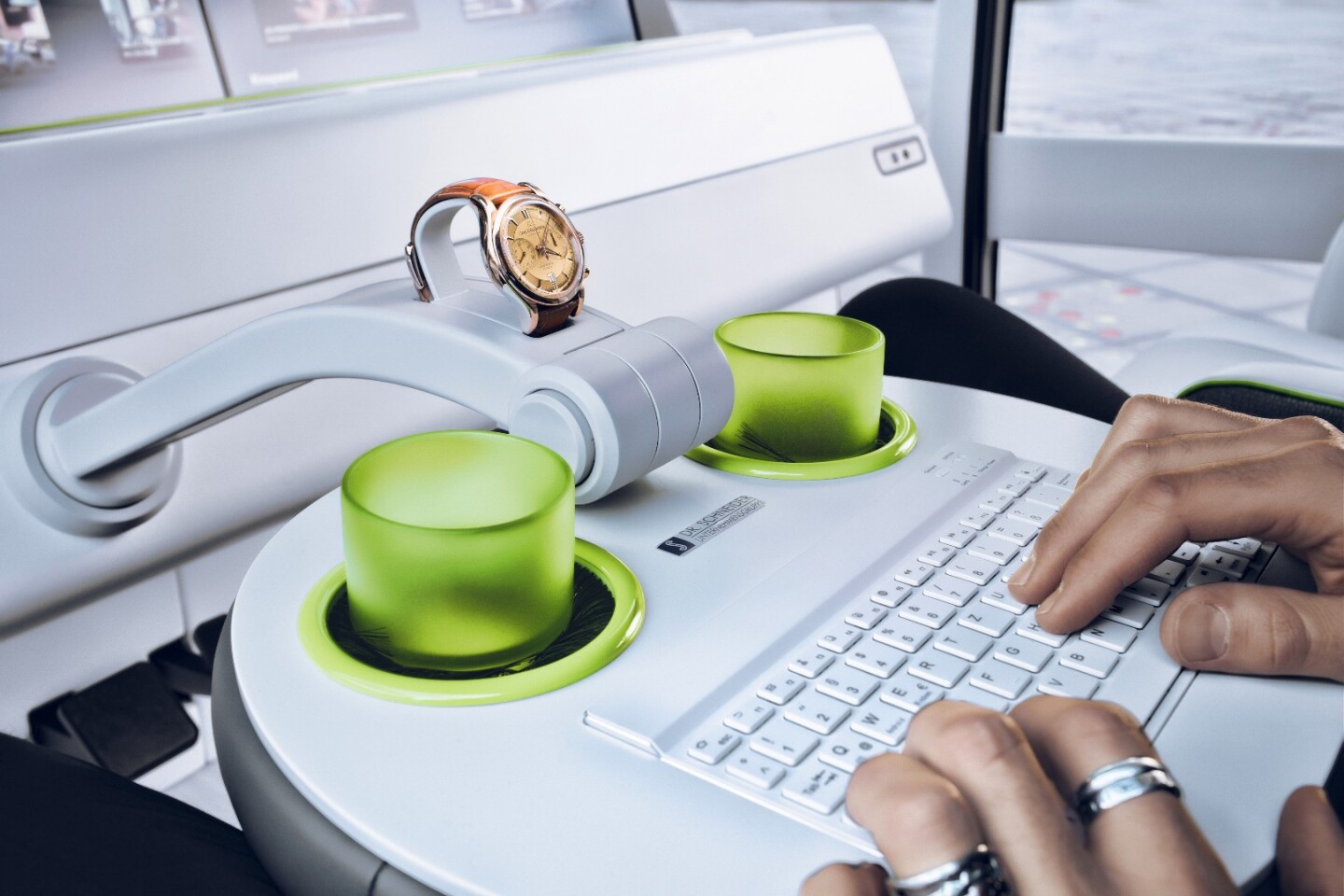The steering wheel flips flat and serves as a table/keyboard