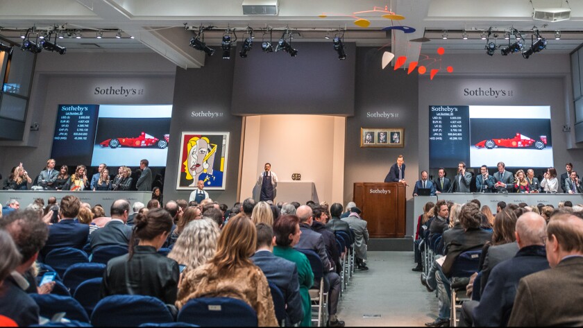 Michael Schumacher's championship-winning Ferrari F2001 is sold before a packed Manhattan auction room at Sotheby’s Contemporary Art Evening Sale, 16 November in New York