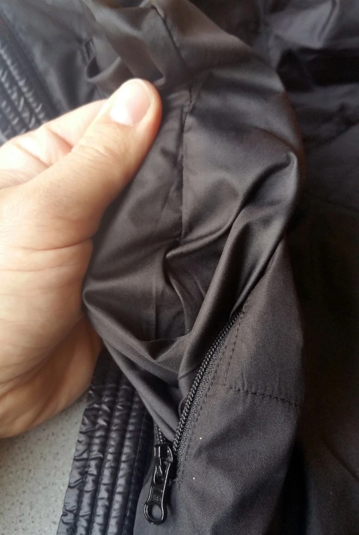 An inside pocket for the Ravean heated vest, showing solid stitching even when gently pulled