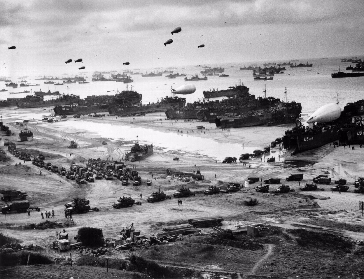 Photographed after the beachhead had been established and the Allied arsenal was being deployed on the Normandy beaches, the sheer magnitude of the operation is evident.