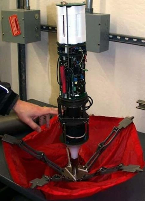 Prototype of the autonomous mooring system attached to an acoustic payload. The mooring system includes an intelligent mooring spool, a combination anchor/air brake and a flotation buoy.