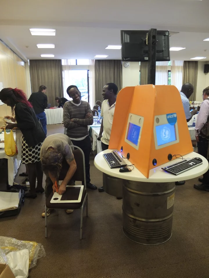 The Digital Drum features three booths, each with its own computer terminal and a "public" screen to the top