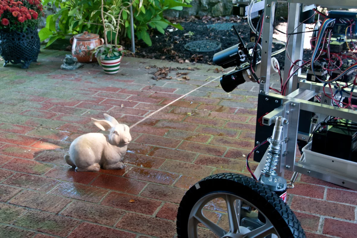 The PatrolBot Mark II shows an unsuspecting garden sculpture who's boss