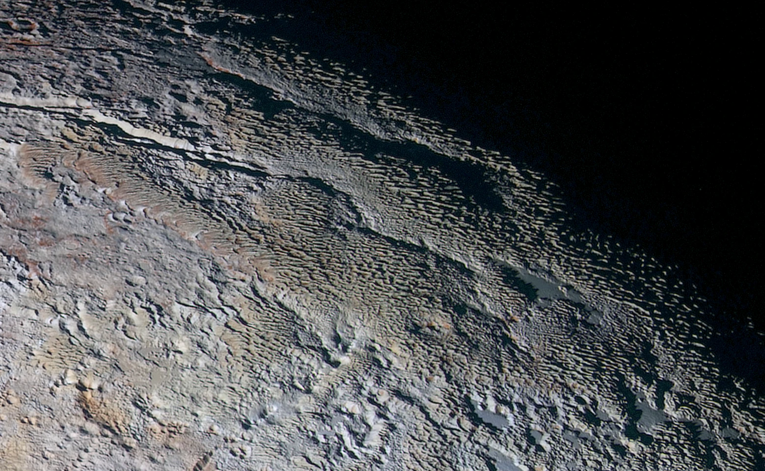 High resolution image of the Tartarus Dorsa mountain range spanning 330 miles (530 km) across