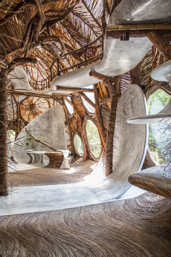 Designed to connect its visitors with nature, guests are invited to wander barefoot across the IK Lab's winding, polished cement floors