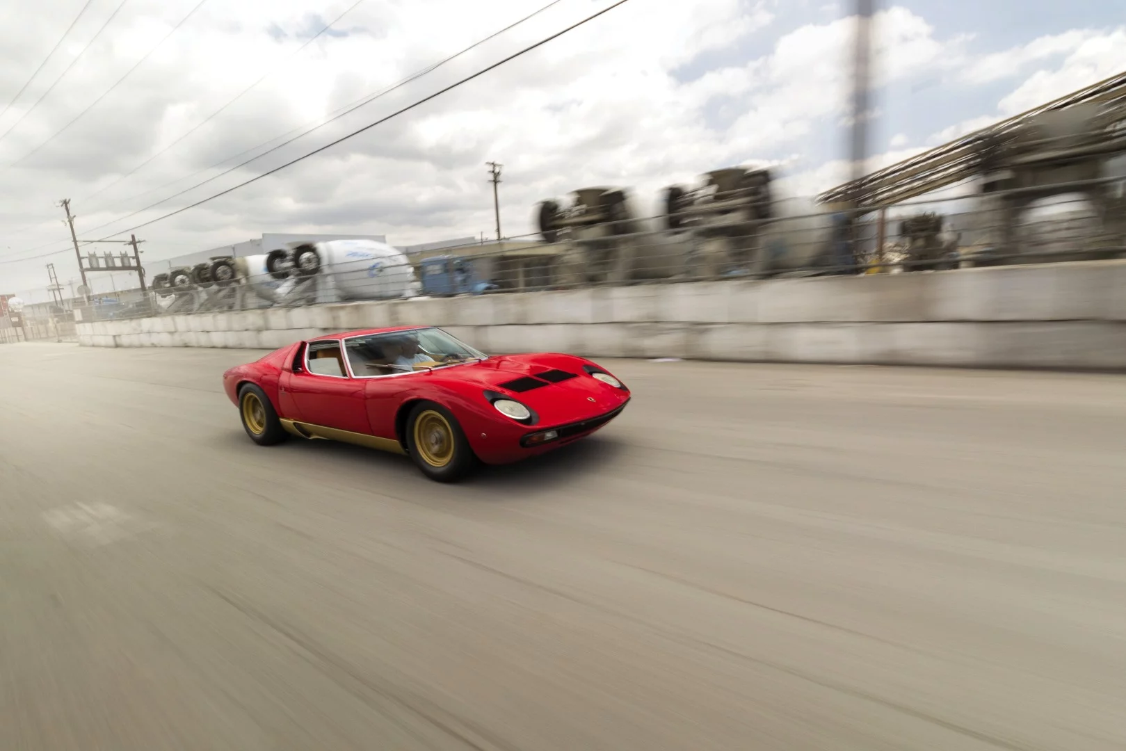 Lot 105 is a 1971 Lamborghini Miura P400 SVn which fetched $2,475,000 to set a new record for the model