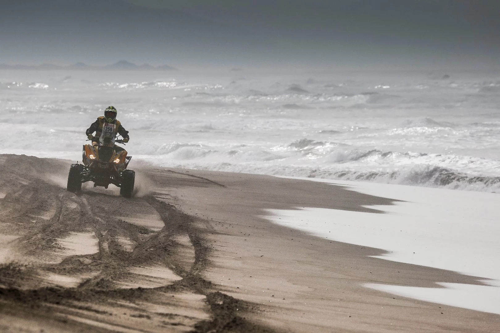Sebastien Souday of France enjoys a bit of an ocean breeze aboard his Yamaha quad bike during Stage 4