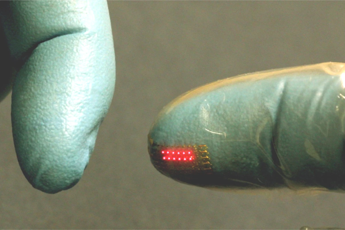 An LED array, transfer printed onto the fingertip of a vinyl glove