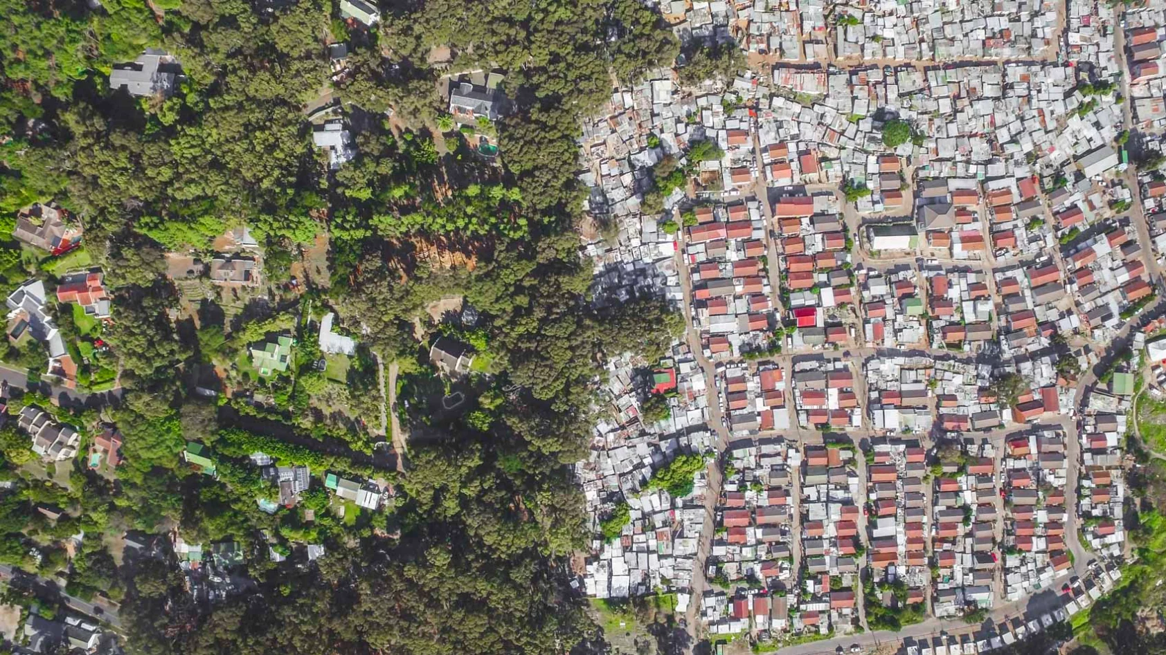Tightly packed tin roofs makeup the Imizamo Yethu settlement in Cape Town, South Africa