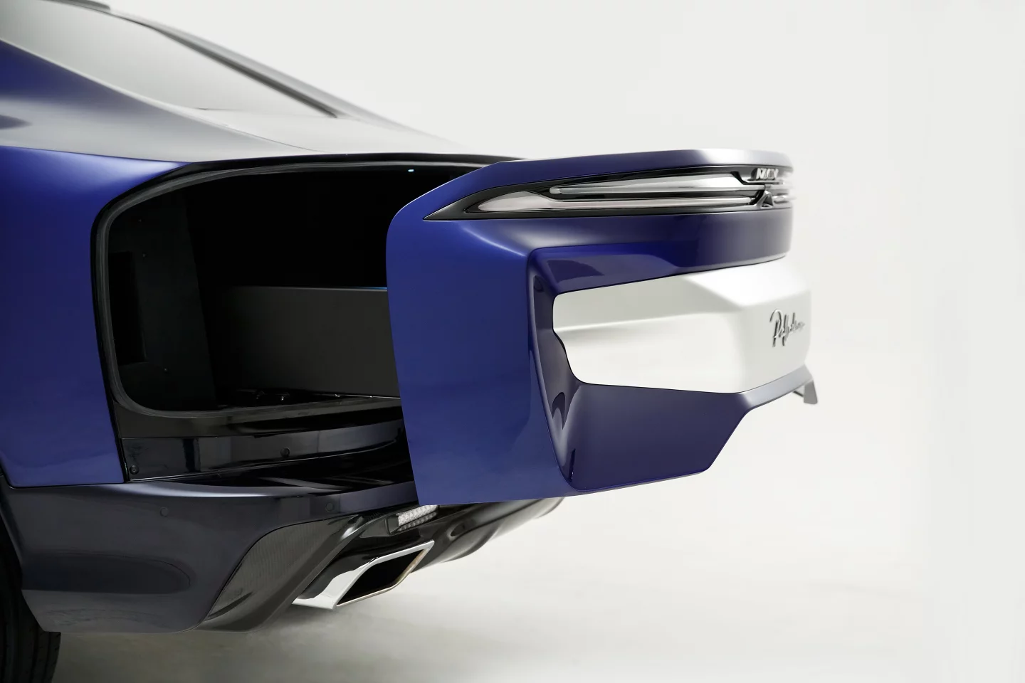 No trunk door or hatchback here, instead a jury-rigged drawer that doesn't look particularly pretty or practical