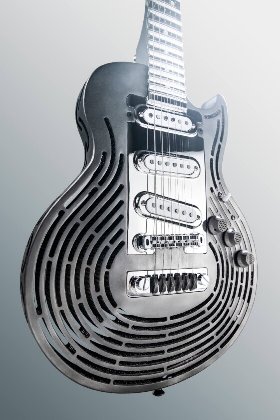 The roughly Les Paul-shaped titanium body of the Smash-Proof Guitar is 3D-printed