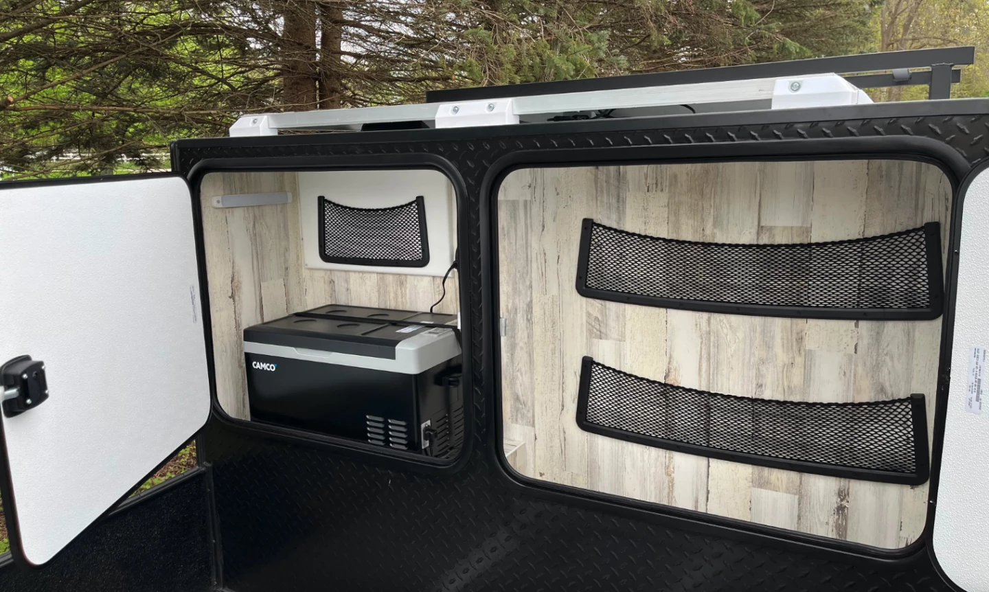 The cabinets have room for a fridge/freezer and other cargo