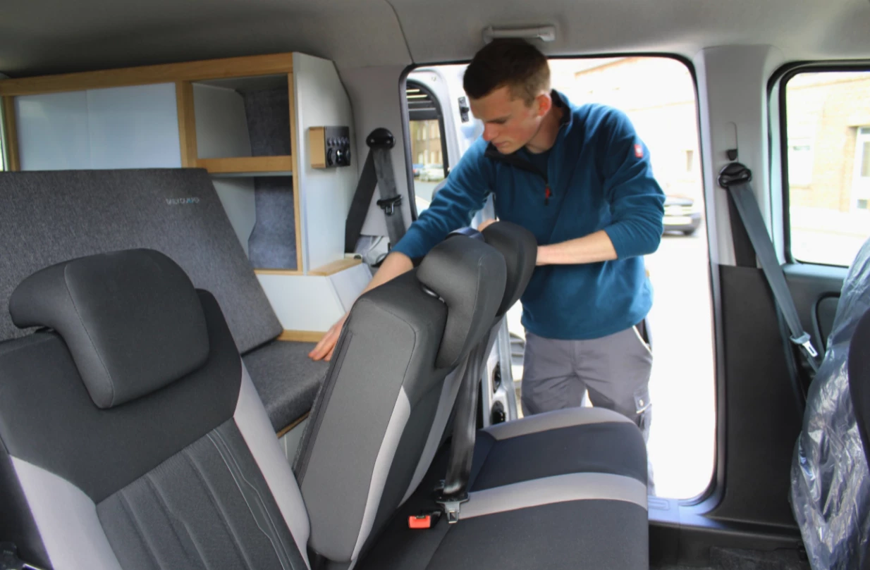 The removable kitchen makes room for three rear seats, turning camper into everyday minivan