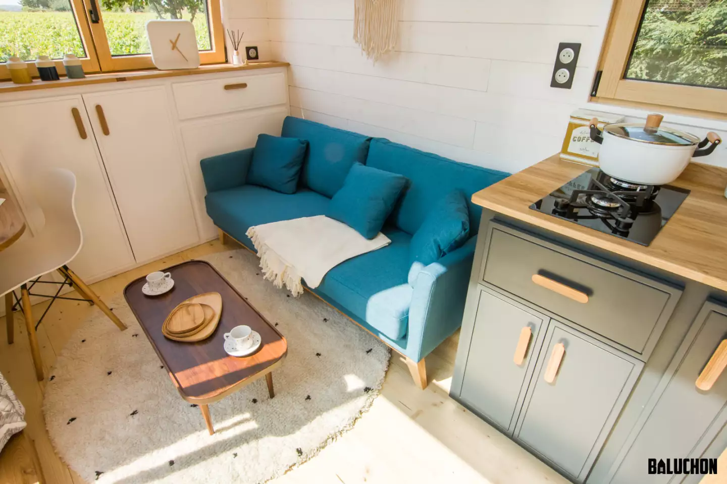 Ia Orana's living room contains a sofa and a small work desk