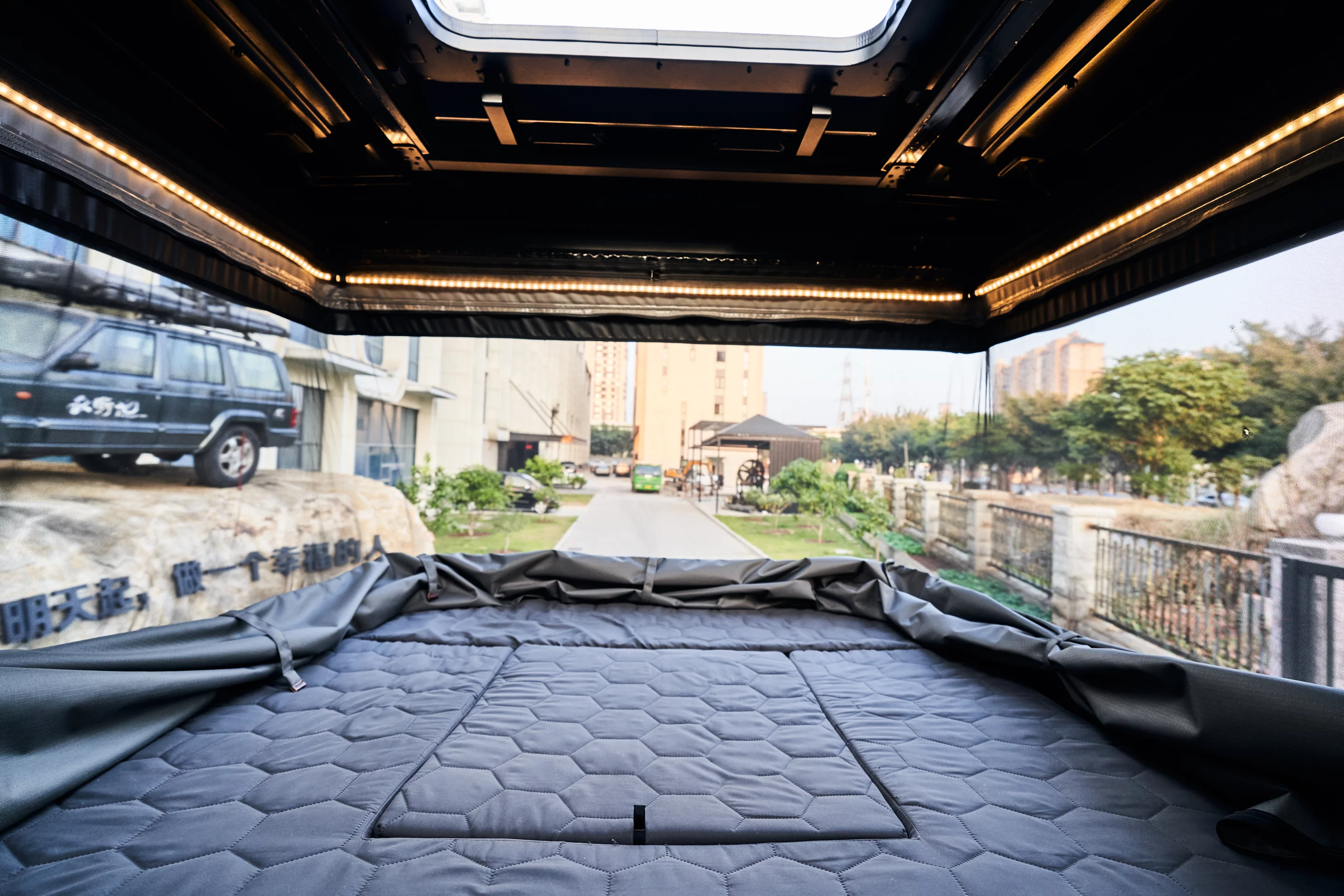 The Safari Cruiser includes a wraparound mesh panoramic window and a fill-in panel to complete the bed over the access hatch