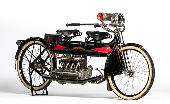 This ultra-rare first-year 1912 Henderson 4 is believed to be one of only six survivors. It’s an older restoration, and was purchased from Cape Town, South Africa in 1983. Remarkably, if you look closely, you'll see that the passenger is seated in front of the rider, between a long pair of ‘wheelbarrow’ handlebars.