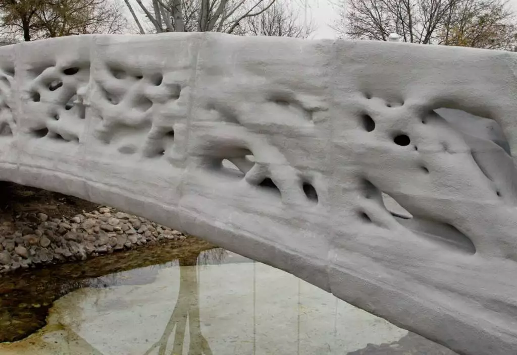 The 3D-printed bridge is constructed out of a fused concrete powder micro-reinforced with thermoplastic polypropylene