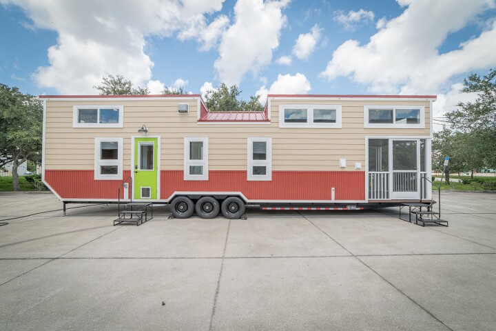 The Movable Roots Elmore front exterior really pops with that lime green door