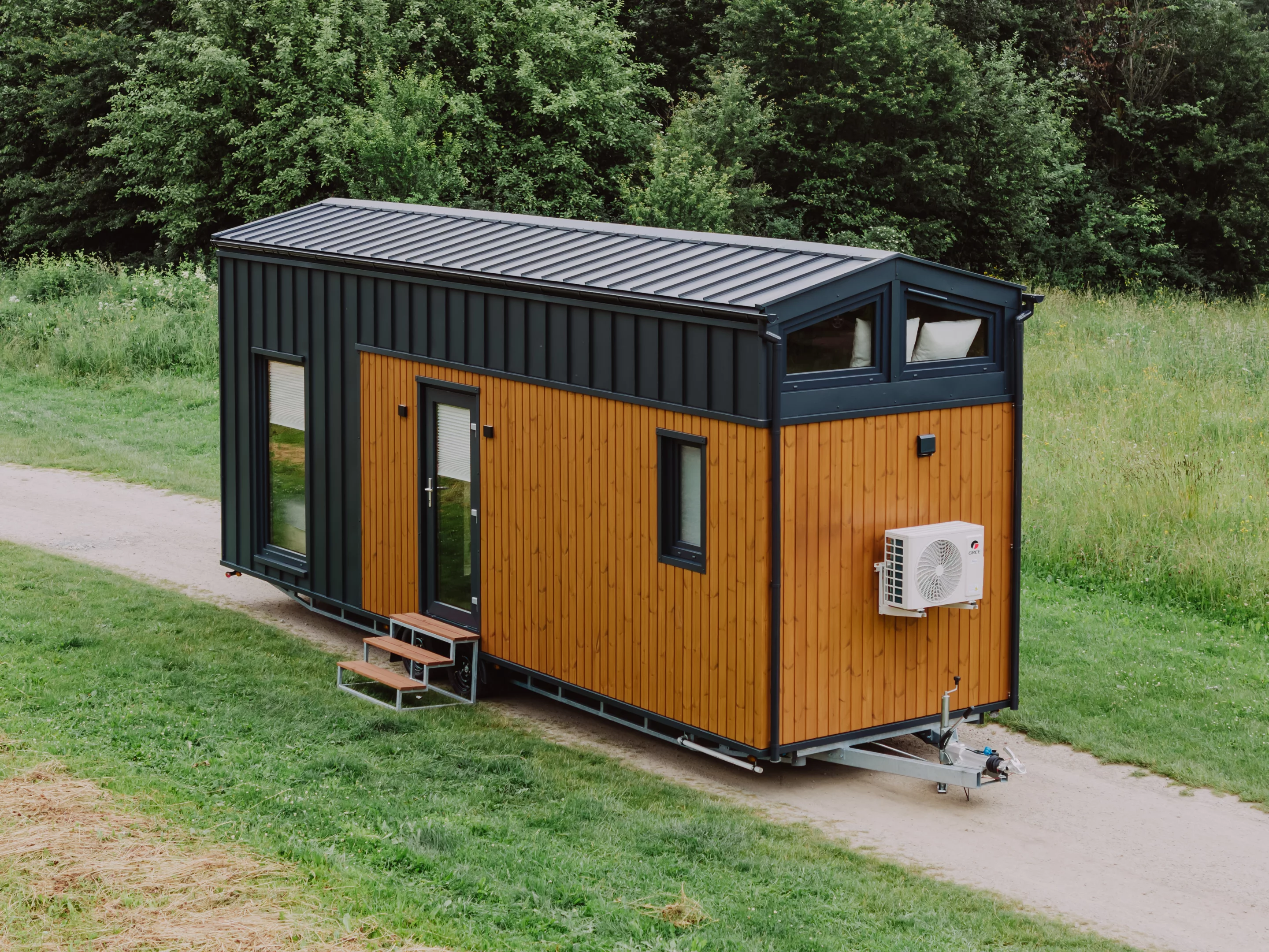 The Alan, by Craft House, is a mid-sized two-bedroom tiny house with a clever space-saving layout