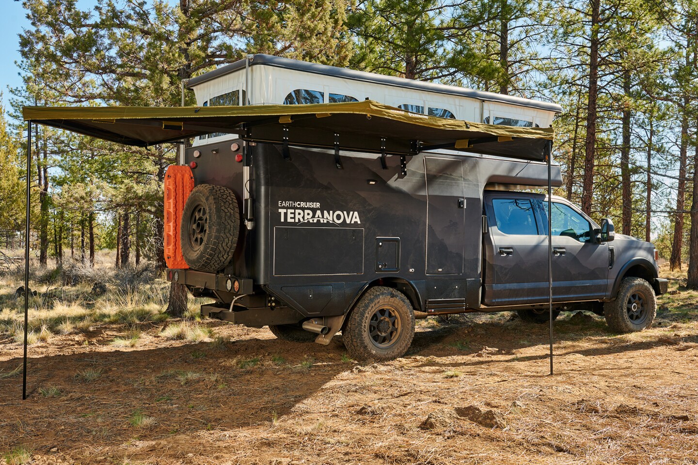 EarthCruiser Terranova with available awning set up and ready to camp