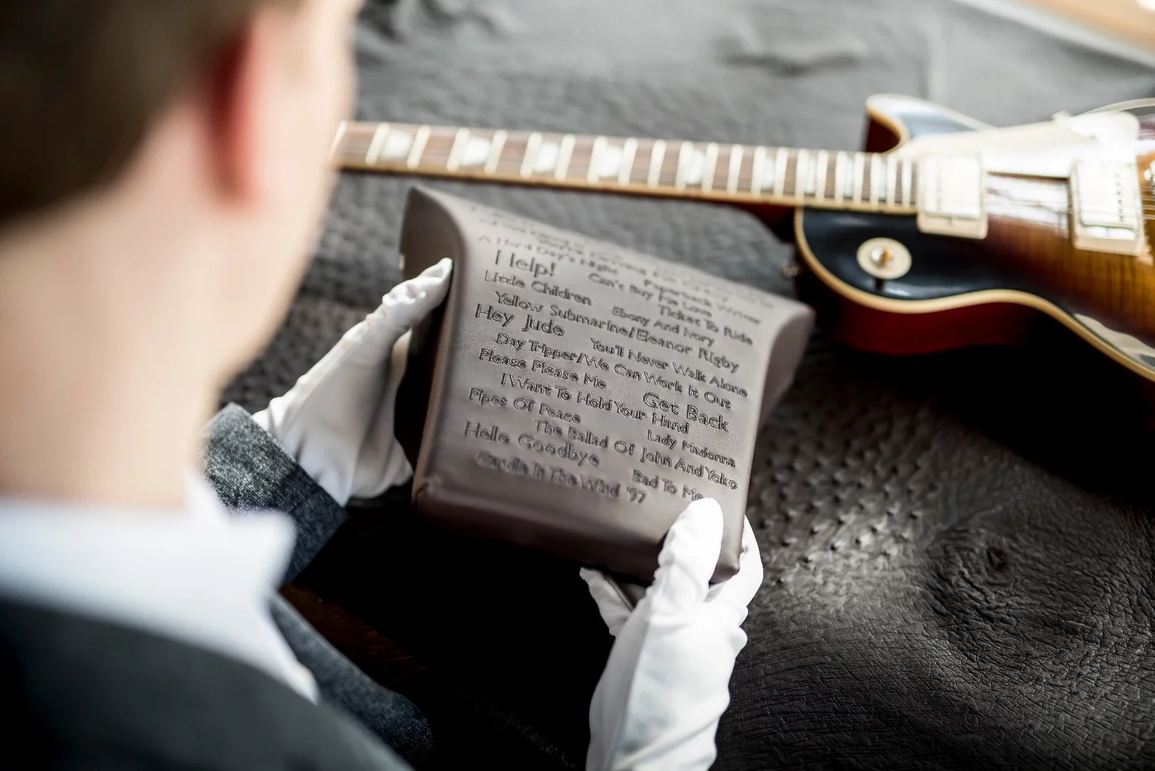 Craftsmen go to work on the George Martin car