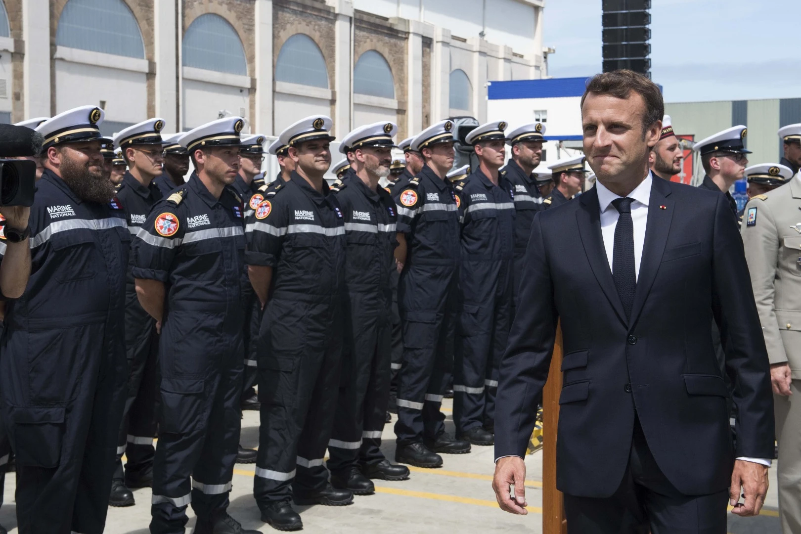 Macron inspecting the company