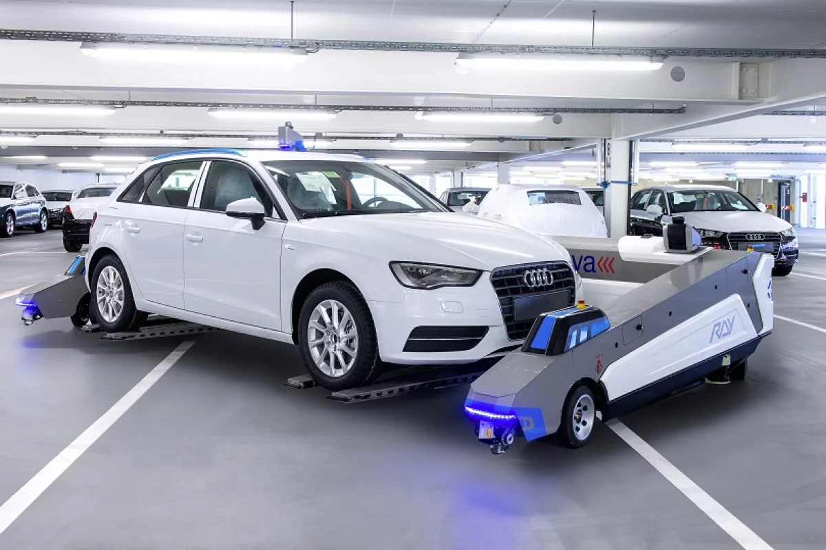 Audi is piloting autonomous robots in its Ingolstadt plant to move cars out of the way until they're needed