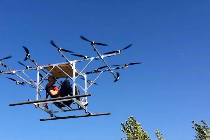 Sky-Hopper's manned multicopter prototype in untethered test flight, with founder Peter Dobber at the controls.